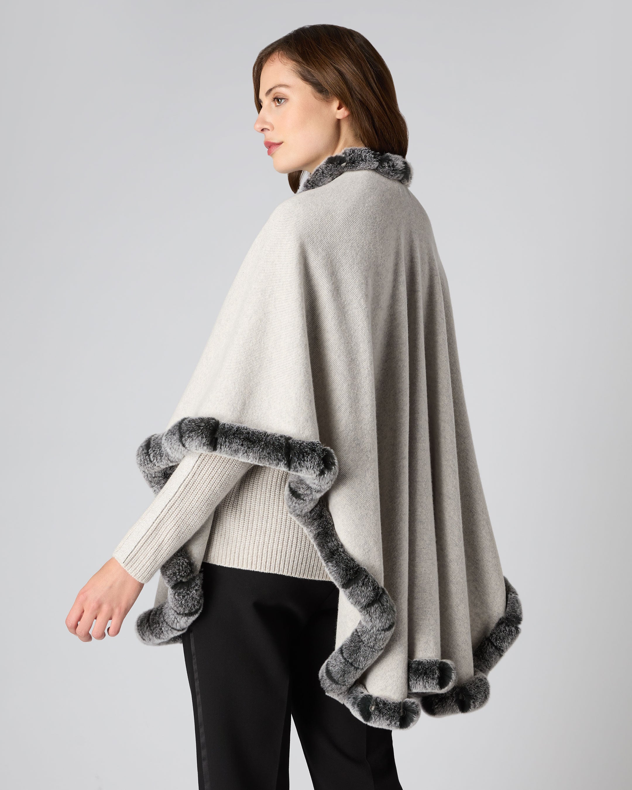 Women's cape with outlet faux fur trim